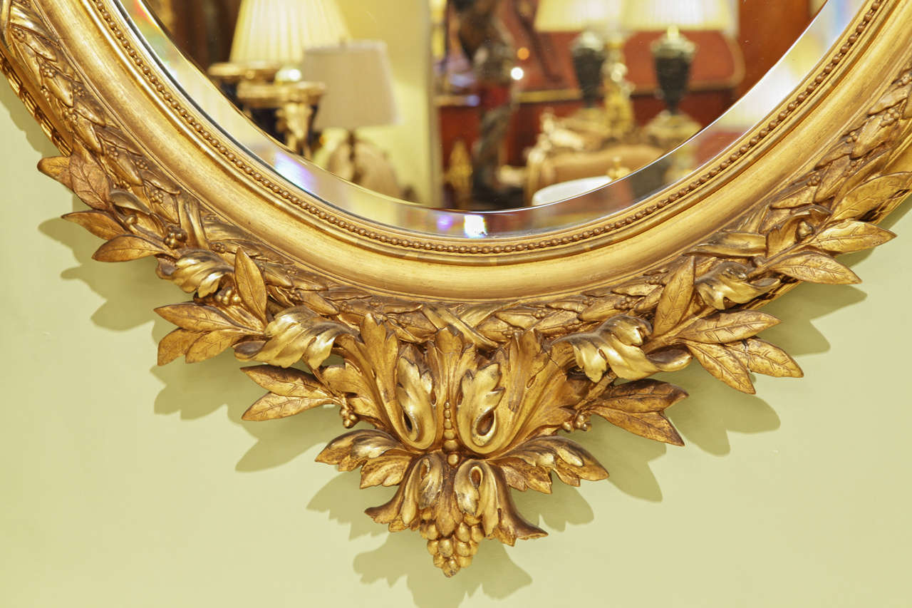 19th Century French Large Louis XVI Gilt Carved Oval Mirror In Excellent Condition In Dallas, TX